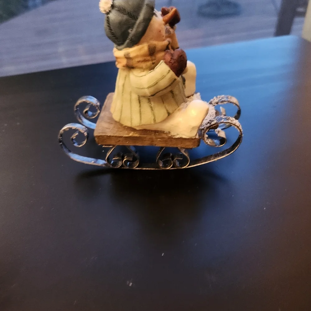 Sledding Snowman Figurine